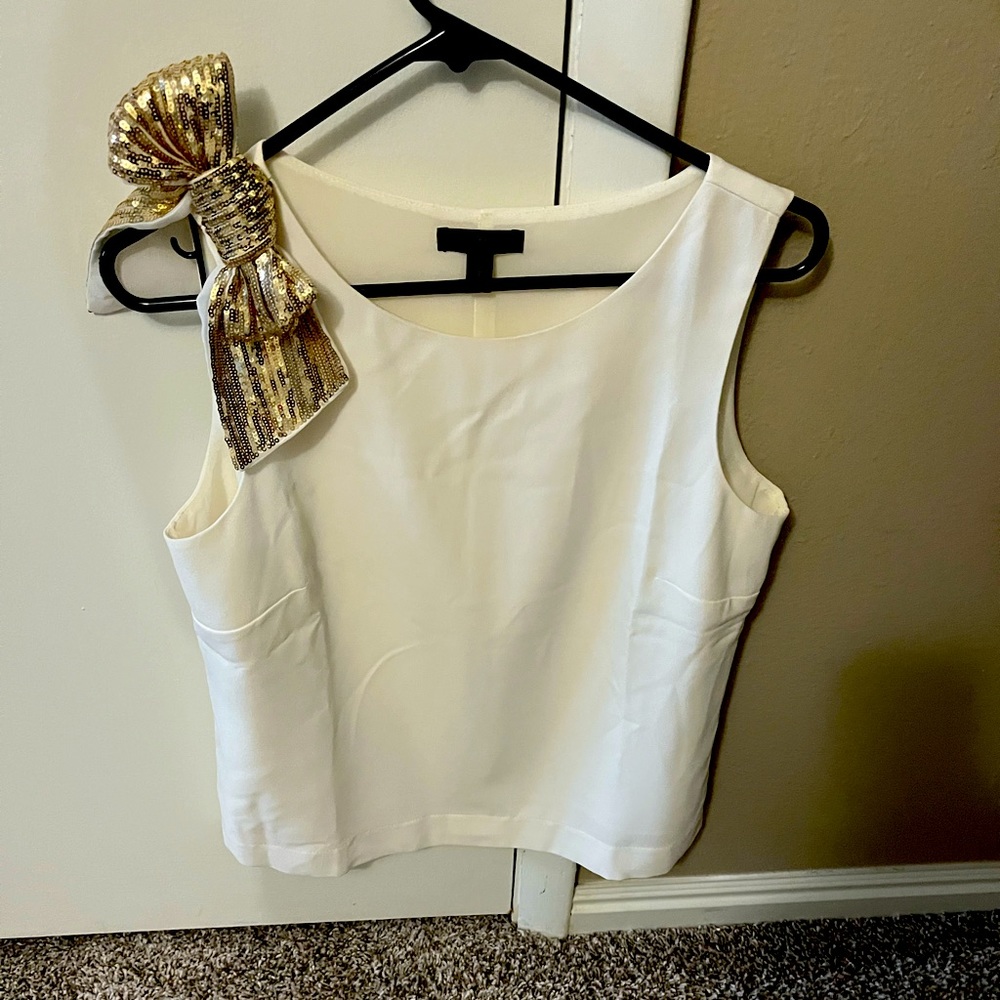 Women white top with gold bow